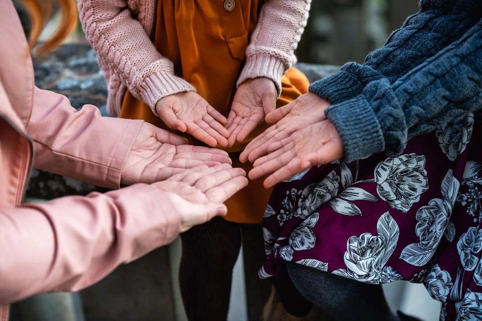 Women joining hands in a circle